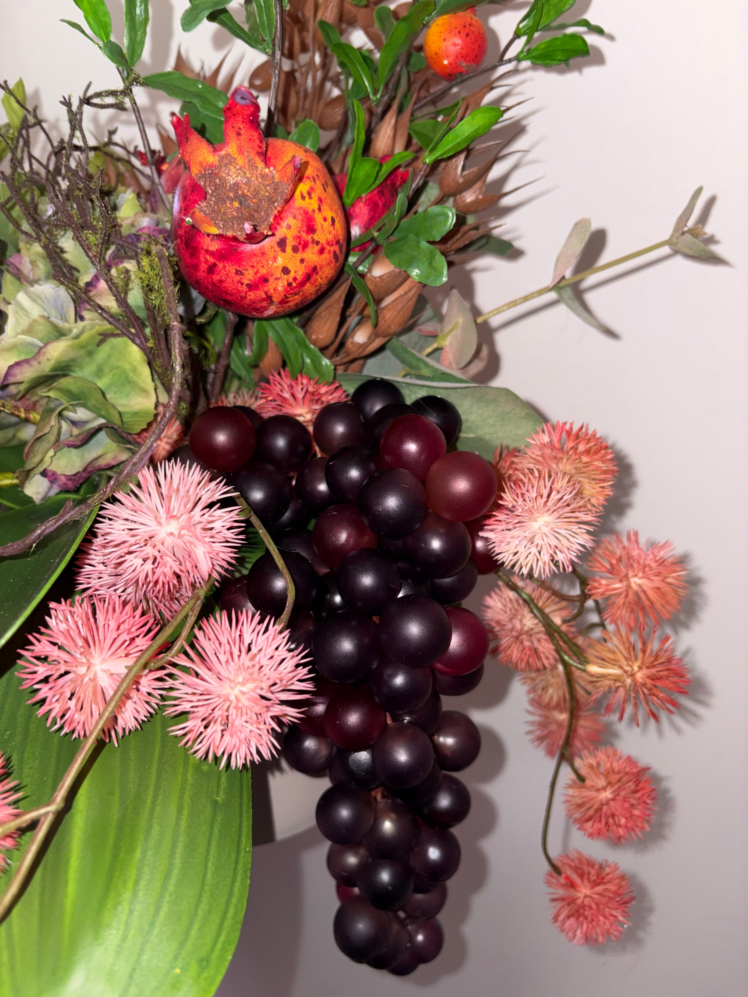 Pomegranate, Winter Berries and Dark Grape Arrangement
