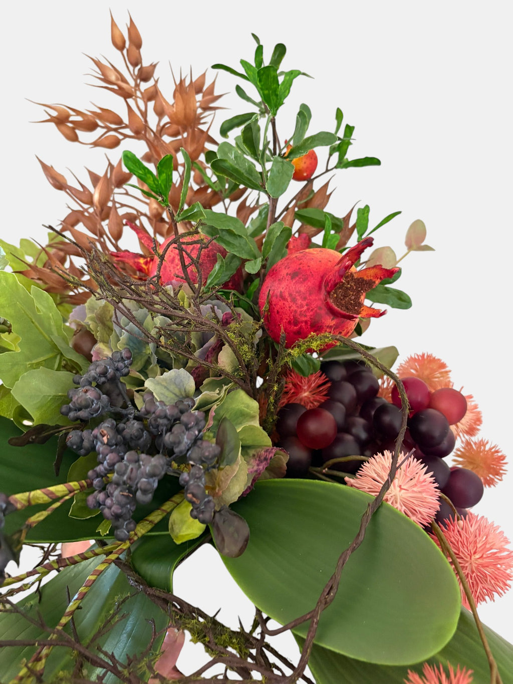 Pomegranate, Winter Berries and Dark Grape Arrangement