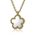 Gold necklace with a clover-shaped pendant on a white background