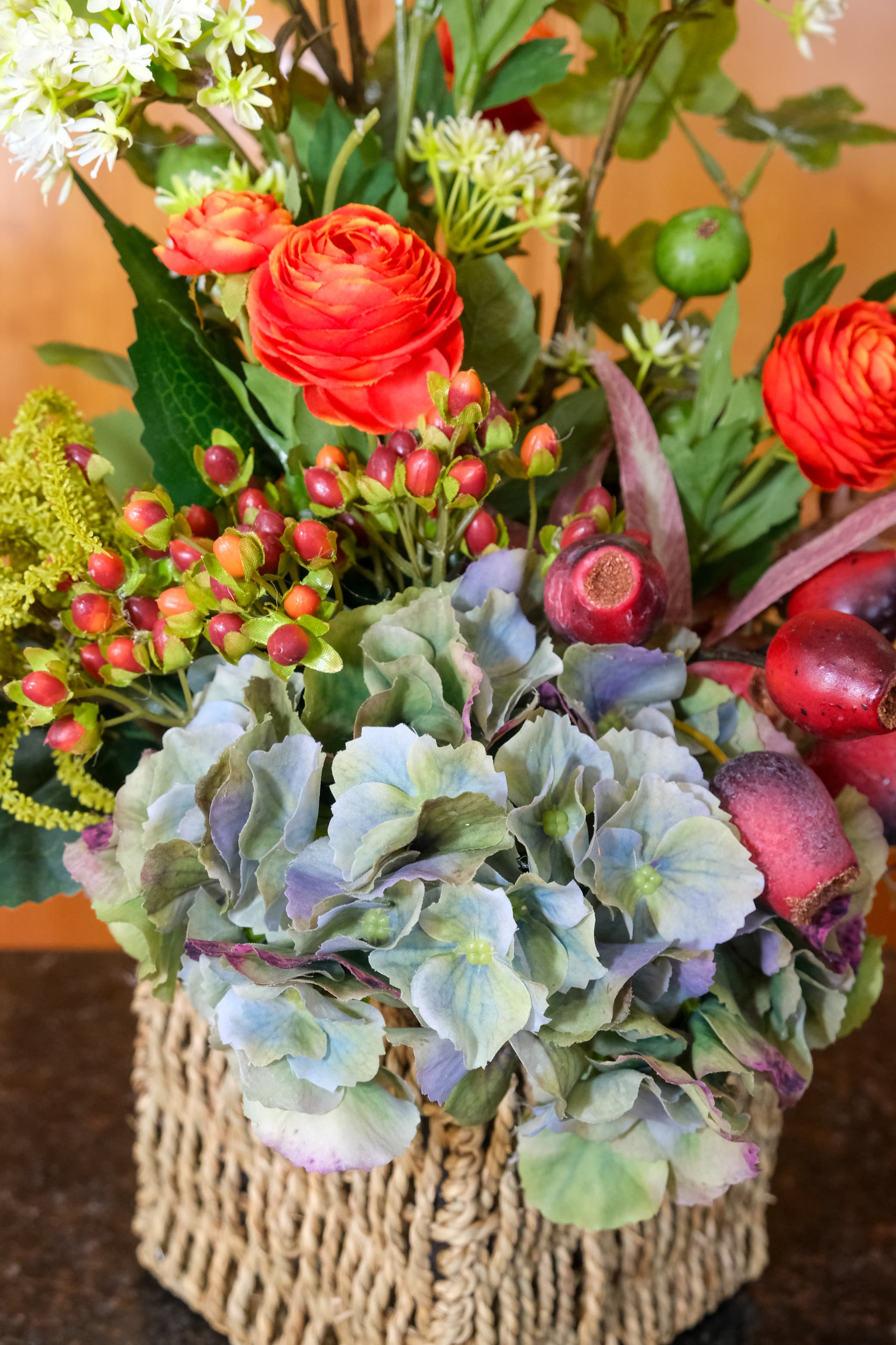 Amber Ranunculus and Gumnut Basket Arrangement