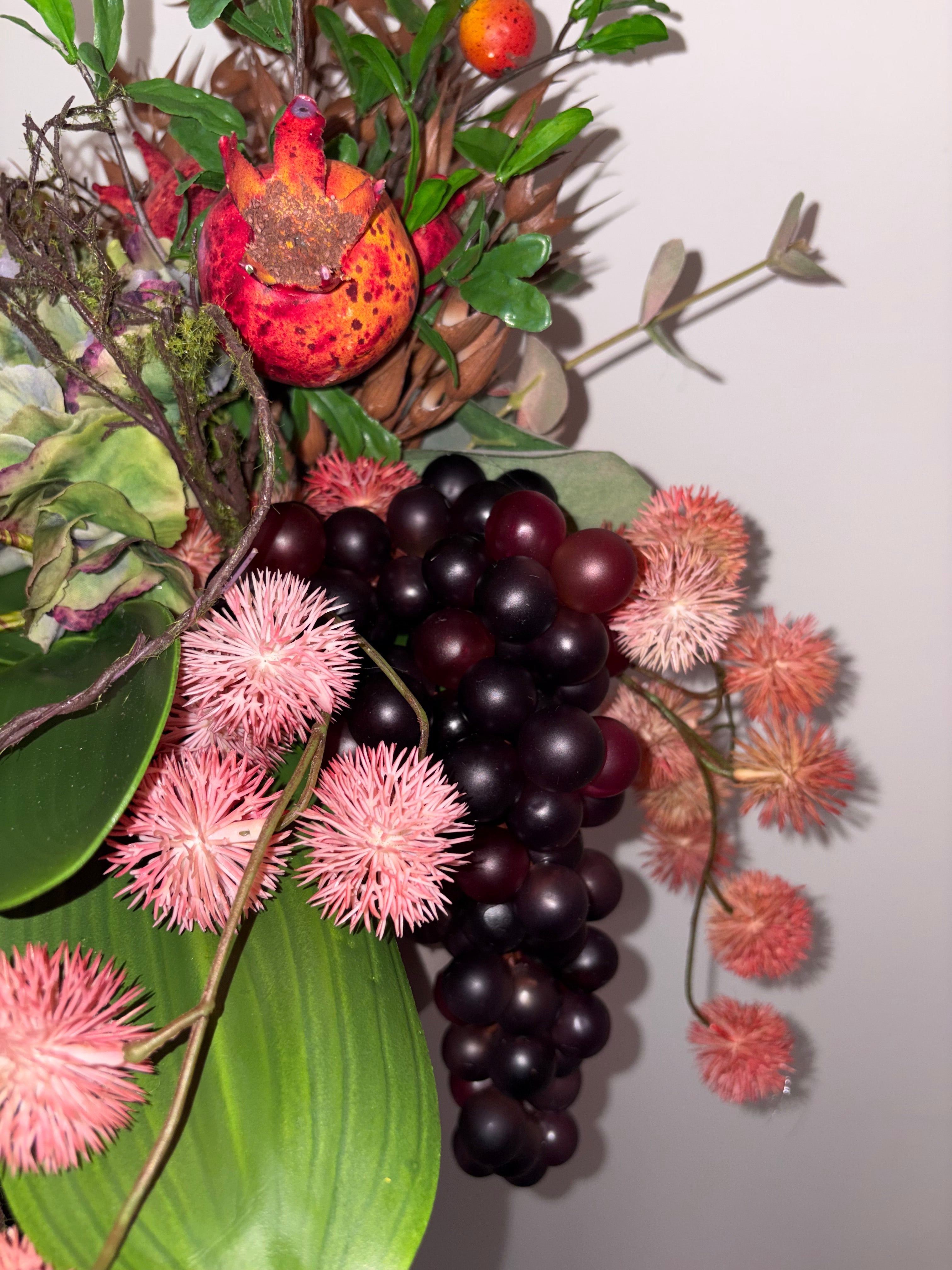 Pomegranate, Winter Berries and Dark Grape Arrangement