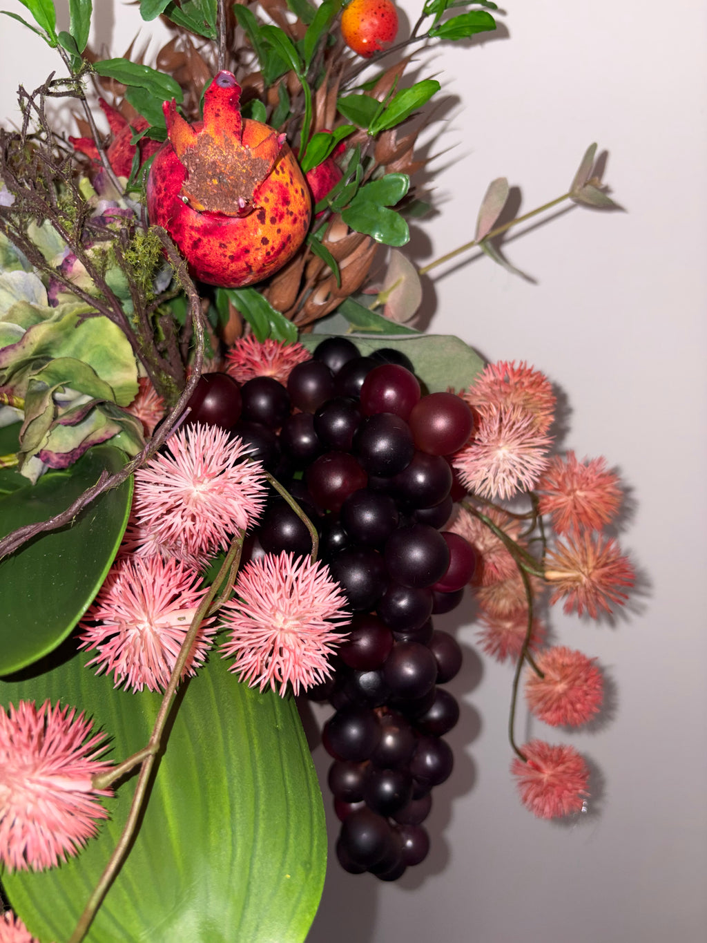 Pomegranate, Winter Berries and Dark Grape Arrangement