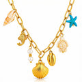 The Velvet Grove gold-tone link necklace featuring seashell, starfish, turtle, and pearl charms for a coastal style.