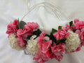 The Velvet Grove floral crown featuring vibrant pink blossoms, cream hydrangeas, and green foliage with ribbon ties.