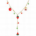 The Velvet Grove gold-tone layered necklace featuring vibrant enamel fruit charms like strawberries, cherries, and apples.