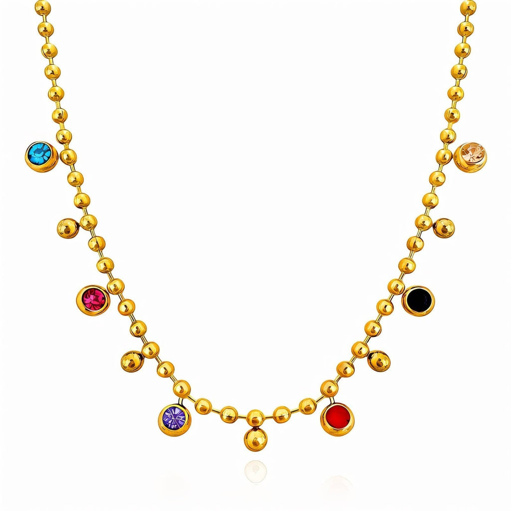 The Velvet Grove gold-tone ball chain necklace featuring scattered multi-colored bezel-set crystal accents.
