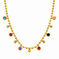 The Velvet Grove gold-tone ball chain necklace featuring scattered multi-colored bezel-set crystal accents.