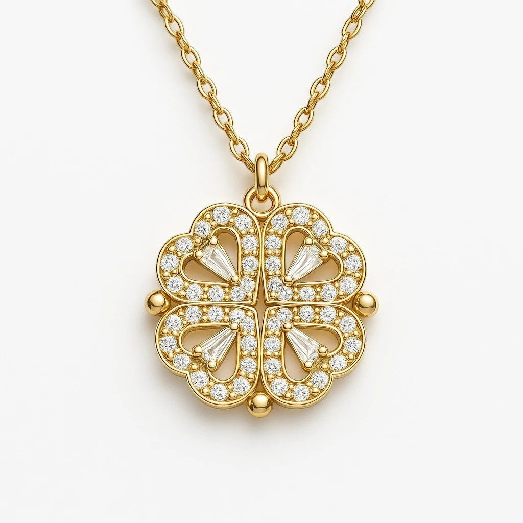 The Velvet Grove gold-tone clover pendant necklace featuring four heart-shaped petals encrusted with sparkling crystals.