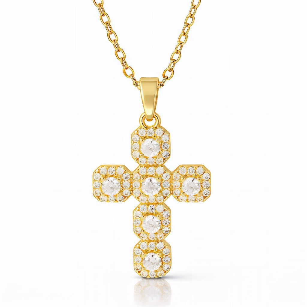 The Velvet Grove gold-tone cross pendant necklace featuring pavé-set cubic zirconia stones on a delicate chain.