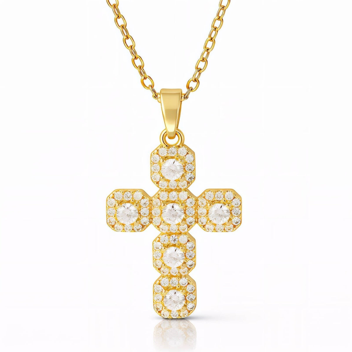 The Velvet Grove gold-tone cross pendant necklace featuring pavé-set cubic zirconia stones on a delicate chain.