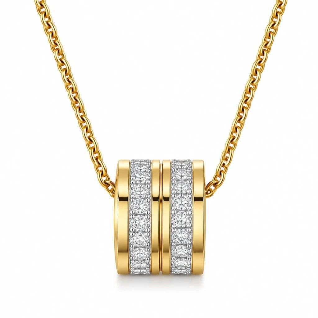 The Velvet Grove gold-tone cylindrical pendant necklace featuring two bands of shimmering pavé-set crystals.