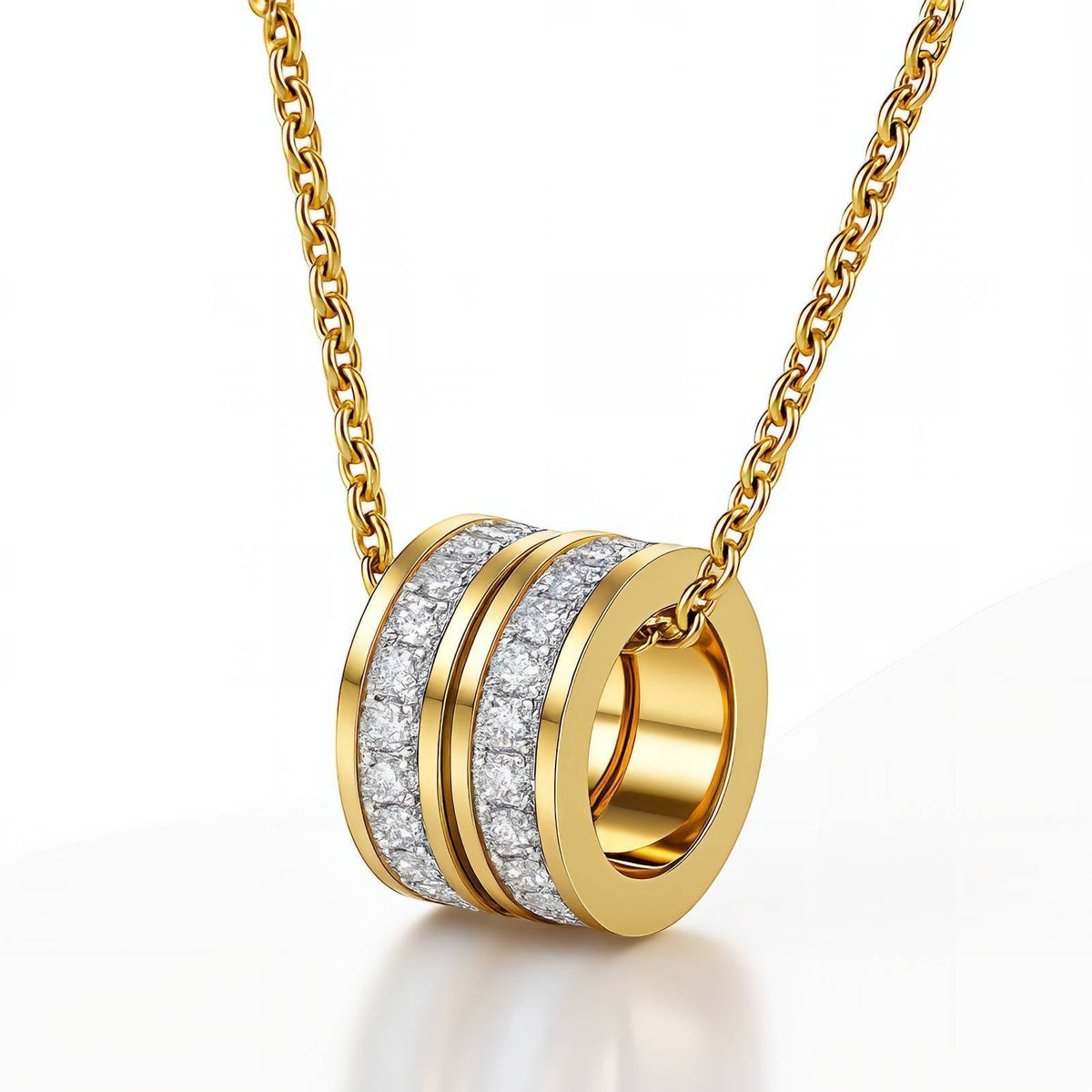 The Velvet Grove gold-tone cylindrical ring pendant necklace featuring pavé-set crystals on a delicate chain