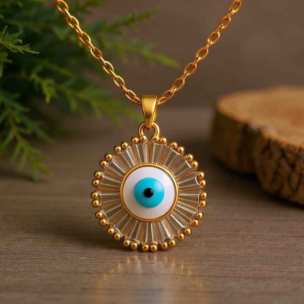 The Velvet Grove gold-tone evil eye pendant necklace with a radiant halo of clear baguette-cut crystals on a chain.
