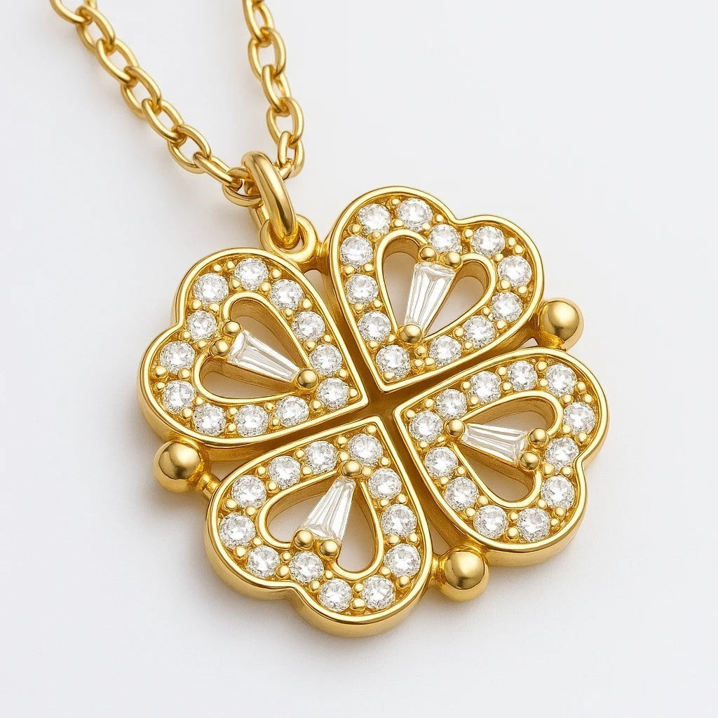 The Velvet Grove gold-tone clover pendant necklace featuring four heart-shaped petals encrusted with sparkling crystals.