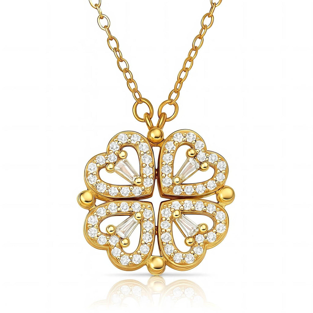 The Velvet Grove gold-tone clover pendant necklace featuring four heart-shaped petals encrusted with clear crystals.