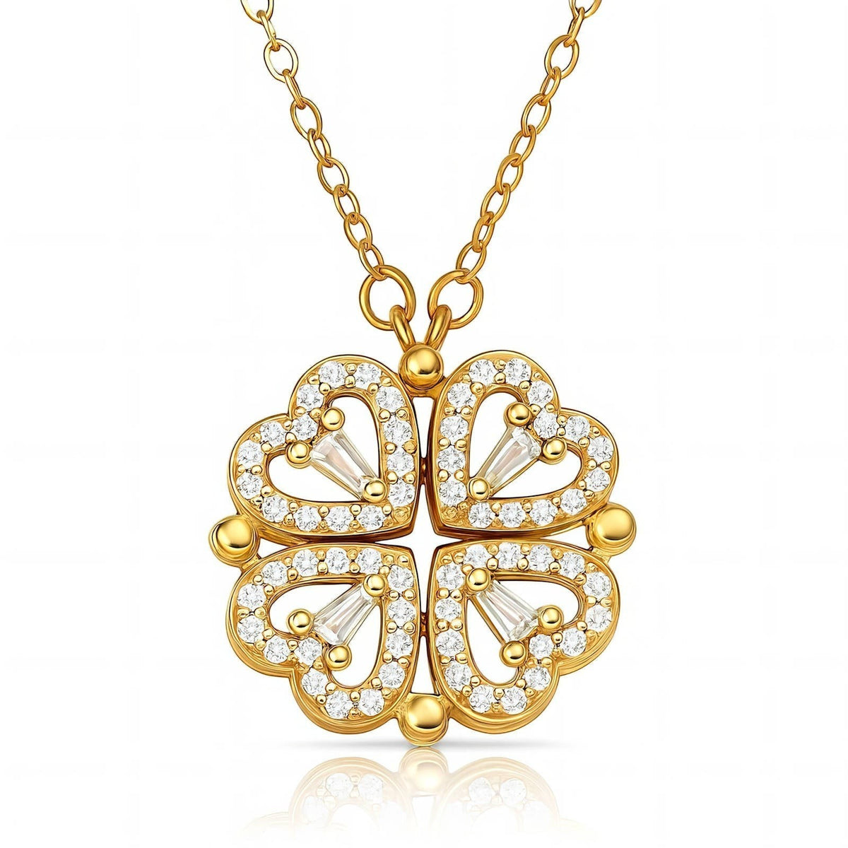 The Velvet Grove gold-tone clover pendant necklace featuring four heart-shaped petals encrusted with clear crystals.