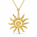 The Velvet Grove gold-tone sun pendant necklace featuring a textured celestial spiral design on a delicate chain.