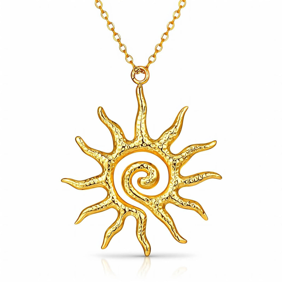 The Velvet Grove gold-tone sun pendant necklace featuring a textured celestial spiral design on a delicate chain.