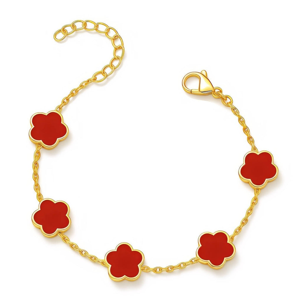 The Velvet Grove gold-tone link chain bracelet featuring vibrant red floral charms with an adjustable clasp.