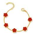 The Velvet Grove gold-tone link chain bracelet featuring vibrant red floral charms with an adjustable clasp.
