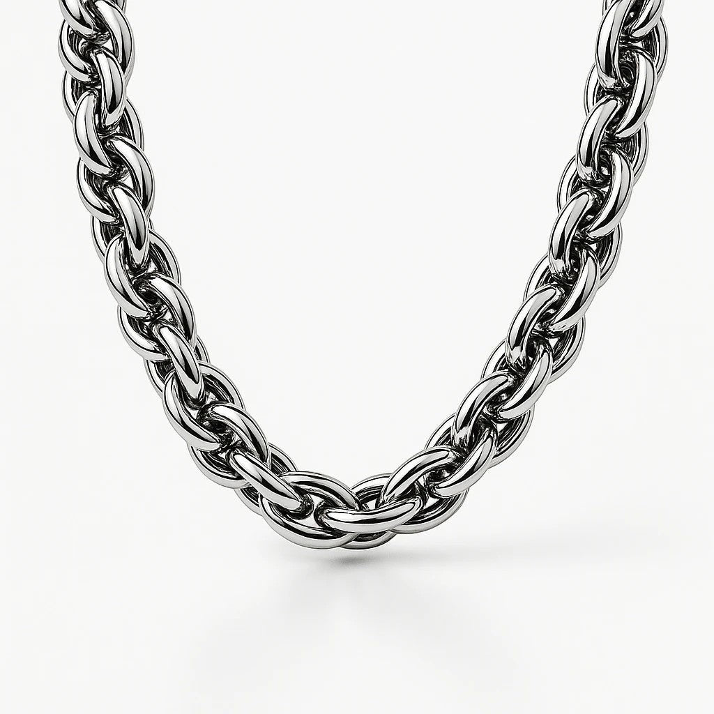 The Velvet Grove silver-tone chunky chain link necklace with a polished metallic finish on a white background.