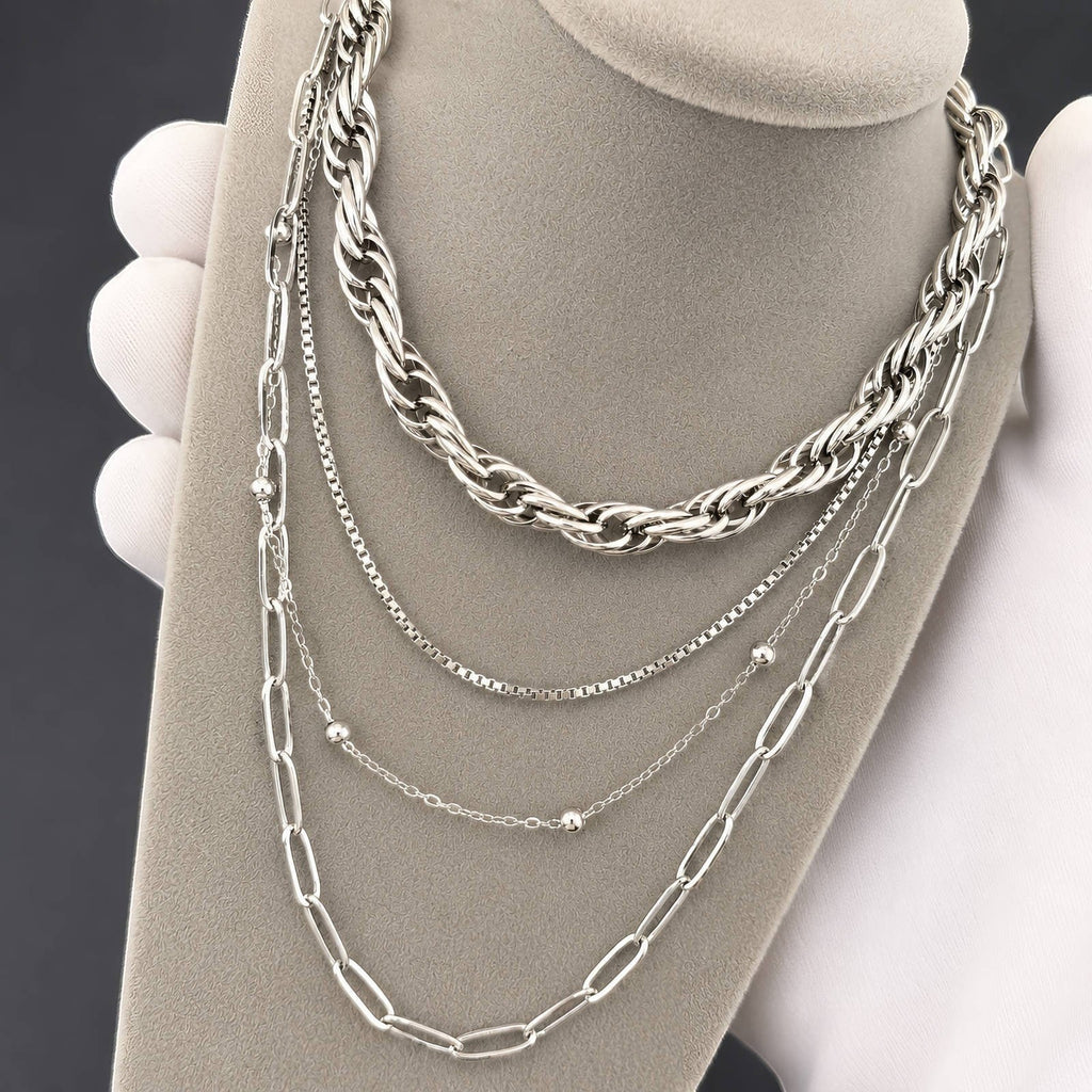 The Velvet Grove silver-tone layered chain link necklace set featuring chunky, paperclip, and beaded chain strands.